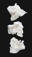 Top view set of screwed or crumpled white tissue paper ball isolated on black background with clipping path photo