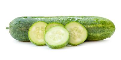 Side view of fresh green cucumber with slices in circle shape in stack isolated on white background with clipping path photo