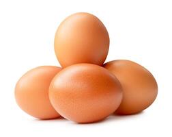 Side view of four brown chicken eggs in stack isolated on white background with clipping path photo