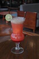 Non-Alcoholic Fresh cocktail on brown table with lemon fruit. fresh drink at the summer outside cofe shop photo