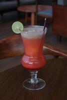 Non-Alcoholic Fresh cocktail on brown table with lemon fruit. fresh drink at the summer outside cofe shop photo