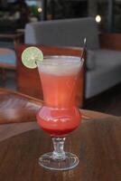 Non-Alcoholic Fresh cocktail on brown table with lemon fruit. fresh drink at the summer outside cofe shop photo