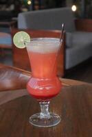 Non-Alcoholic Fresh cocktail on brown table with lemon fruit. fresh drink at the summer outside cofe shop photo