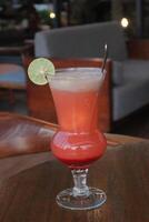 Non-Alcoholic Fresh cocktail on brown table with lemon fruit. fresh drink at the summer outside cofe shop photo