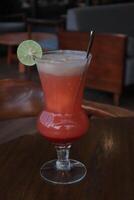 Non-Alcoholic Fresh cocktail on brown table with lemon fruit. fresh drink at the summer outside cofe shop photo