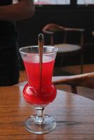 Non-Alcoholic Fresh cocktail on brown table with lemon fruit. fresh drink at the summer outside cofe shop photo