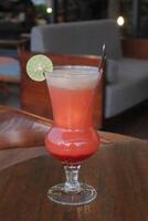 Non-Alcoholic Fresh cocktail on brown table with lemon fruit. fresh drink at the summer outside cofe shop photo