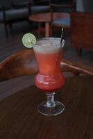Non-Alcoholic Fresh cocktail on brown table with lemon fruit. fresh drink at the summer outside cofe shop photo