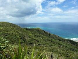 Distant Lighthouse on Grassy Vista photo