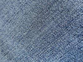 Denim fabrics pattern close view background, jeans textile cloth macro view photo
