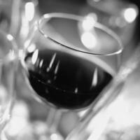Red wine in a glass close view background photo