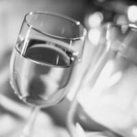White wine in a glass close view background photo