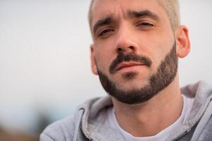 Close up portrait of a young bearded man. photo