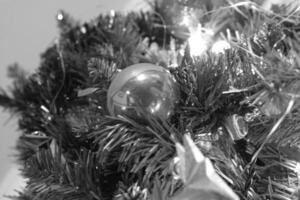 Decoratively Adorned Christmas Tree with Gold Ornaments and Evergreen Branches photo