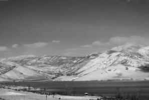 Mountain Landscape with Snow, Ice Cap, and Clouds photo