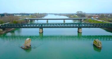 The concrete foundations of a bridge removed from the river video