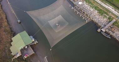 Aerial view of a fishing net above the river video