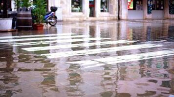 Asphalt road with crosswalk covered with high flood water video