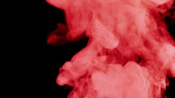 Red smoke on black background video