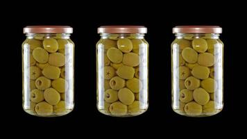 Three containers with olives on a black background video
