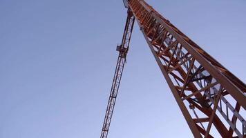 Orange crane on the background of the clear sky video