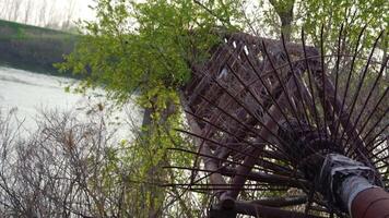 An old metal pipe crosses the river video