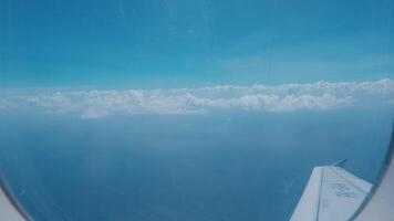 Aerial View of Blue Sky and Clouds from Airplane Window video