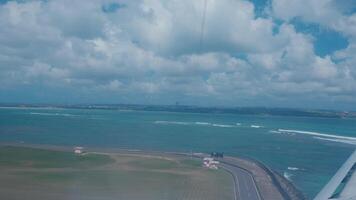 Aerial View of Water and Clouds from Airplane Window video