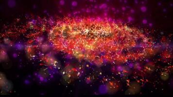 a bright galaxy made of billions of particles glows with neon and moves in space video