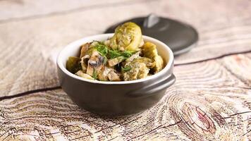 Brussel sprouts stewed in sour cream sauce with mushrooms and spices video