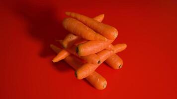A bunch of carrots on the red table video