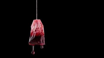 Single used teabag with tea flowing in slow motion video