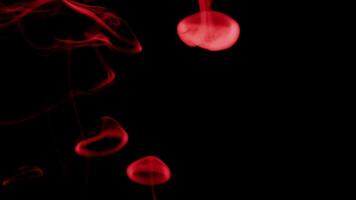 Red smoke on black background video