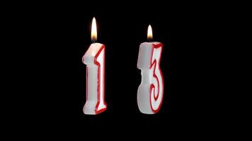 Candle with the number thirteen rotates on a white background video