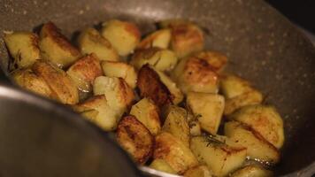 Potatoes are fried in the pan video