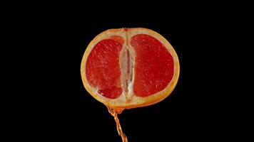 Juice flows from the cut grapefruit video