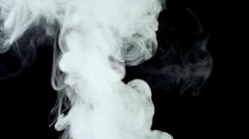 Smoke on a black background appears from below video