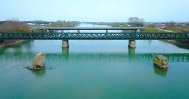 The concrete foundations of a bridge removed from the river video
