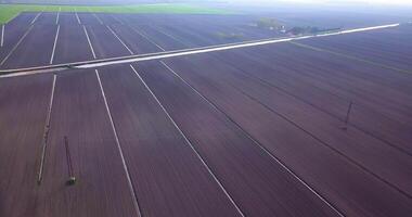Freshly worked fields with water channels on the sides video
