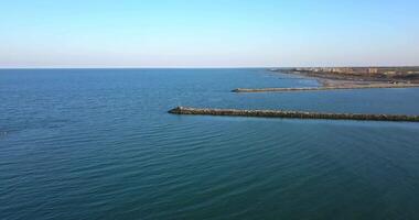 Two dams that close the exit of a river into the sea video