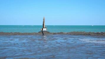 Timelapse of the excavator working in front of the sea video