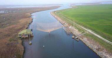Aerial view of a fishing net above the river video
