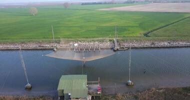 Aerial view of a fishing net above the river video