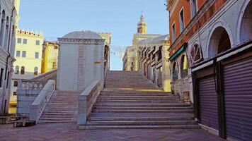 Stone steps of Rialto bridge with arch passages in Venice video