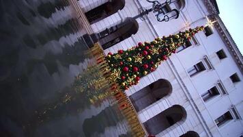 Artificial Christmas tree reflects in flood water diagonally video