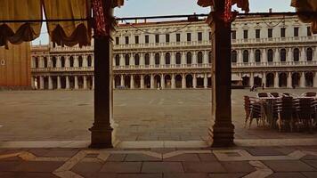 Motion through arch to empty historical St Mark square video