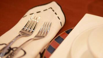 An Elegant Dining Setting Featuring Forks and a Beautiful Plate Placed on a Table video