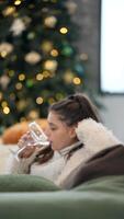 Embracing Cozy Winter Vibes While Enjoying a Refreshing Glass of Water Next to the Christmas Tree video