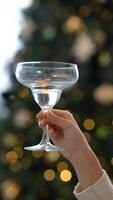 Enjoying a Celebratory Toast with a Beautiful Cocktail Glass in a Festive and Joyful Setting video