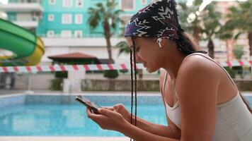 Relaxing by the Pool While Enjoying My Smartphone on a Beautiful Sunny Day This Summer video